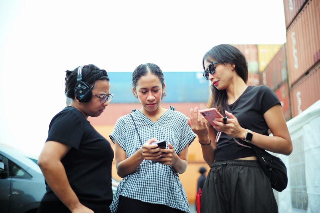 group of friends scrolling phones